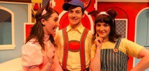 Betsy Bear (Devon Busswood), Huckle Cat (Colin Sheen) and Grocer Cat (Kayla Dunbar) in the Carousel Theatre for Young People production of Richard Scarry’s Busytown.