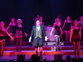 Andrew Cownden as The Emcee and the Kit Kat Boys & Girls in the Royal City Musical Theatre production of Cabaret. Photo by Emily Cooper.