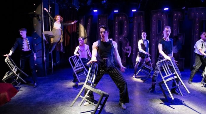 Erin Palm as Sally Bowles and the Kit Kat Klub Boys in the Studio 58 production of Cabaret. Photo by David Cooper.