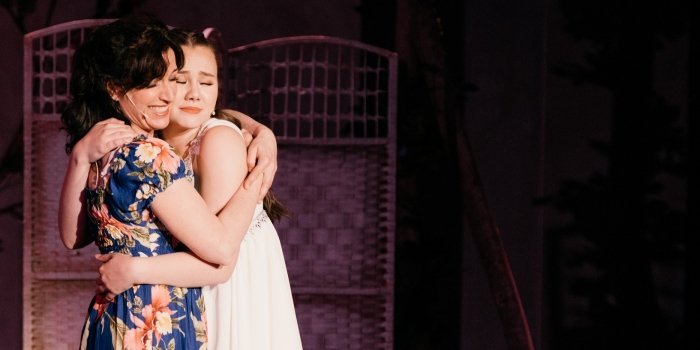 Caitriona Murphy and Keira Jang as mother and daughter in the Theatre Under the Stars production of Mamma Mia! Photo by Lindsay Elliott.