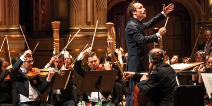 Maestro Otto Tausk conducts members of the Vancouver Symphony Orchestra.